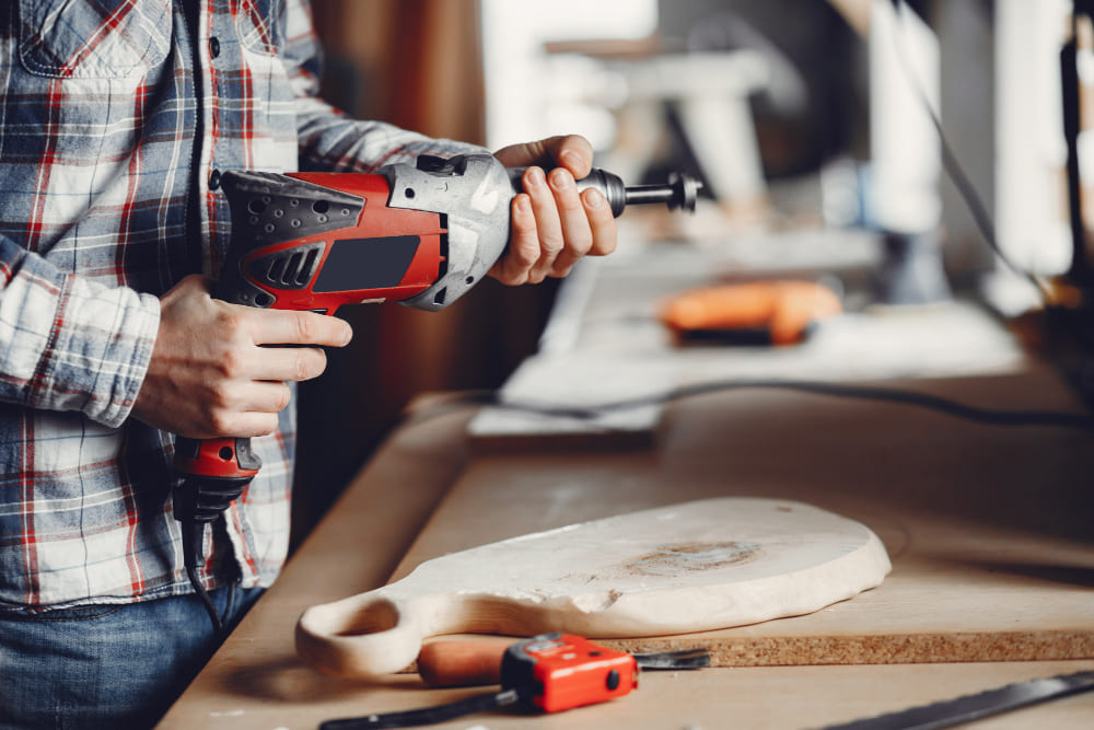 carpenter holding a power tool